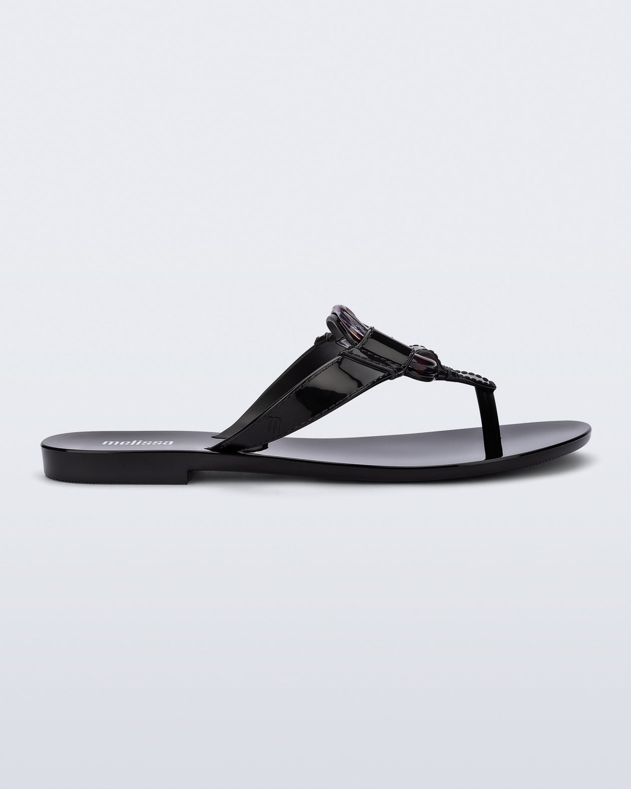 Side view of a black Olivia adult flip flop