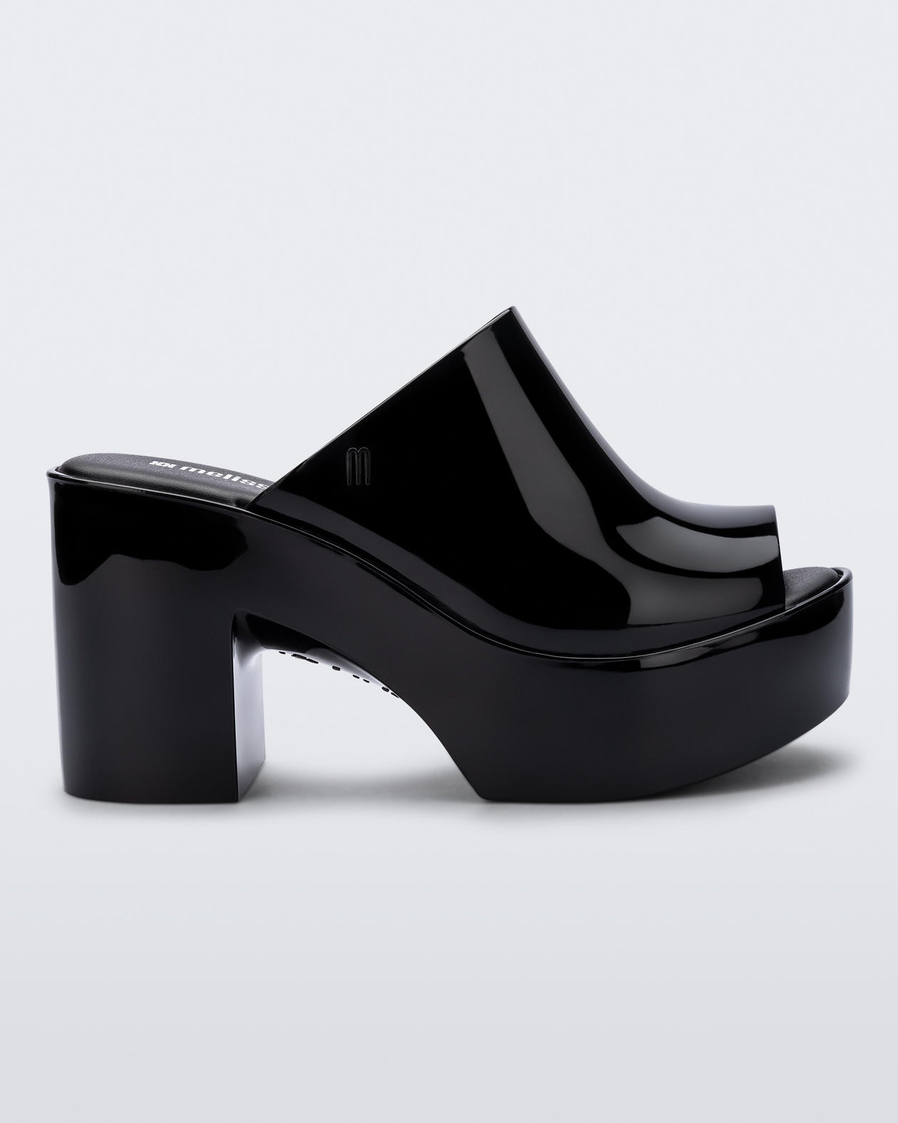 Side view of a black Mule Hype heel platform