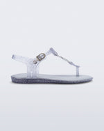 Side view of a clear glitter Solar kids sandal