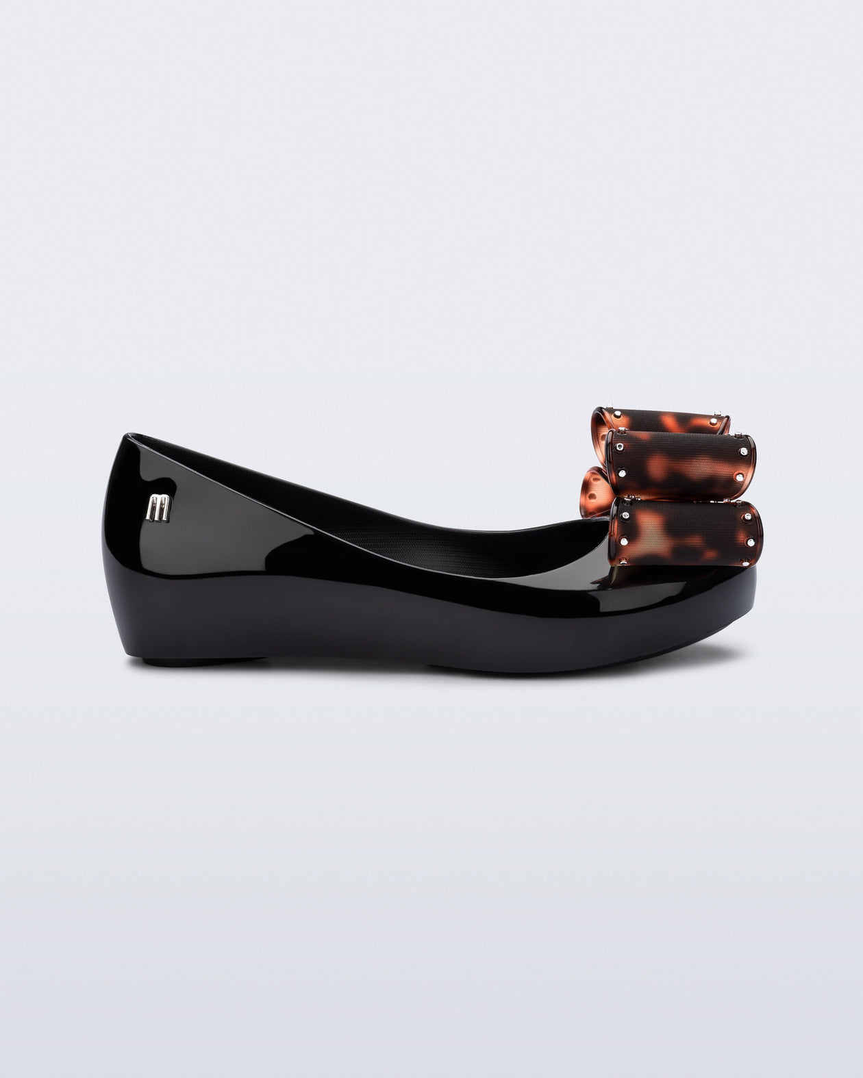 Side view of a black kids Ultragirl Classic Bow kids flats with tortoise bow