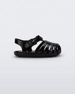 Side view of a black baby My First Mini Melissa Possession sandal