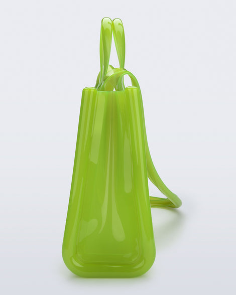 Side view of the green Large Jelly Shopper x Telfar bag