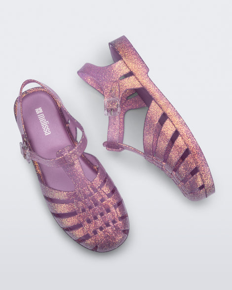 Top view of a pair of glitter lilac Possession sandals