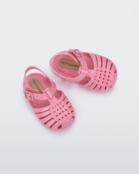 Top angled view of a pair of pink baby My First Mini Melissa Possession sandals.