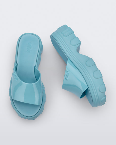 Side and top view of a pair of blue Ella slide platforms