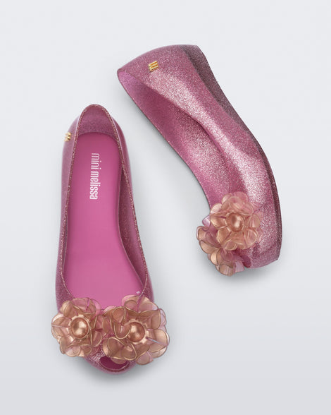 Top and side view of a pair of glitter pink kids Ultragirl Springtime flats