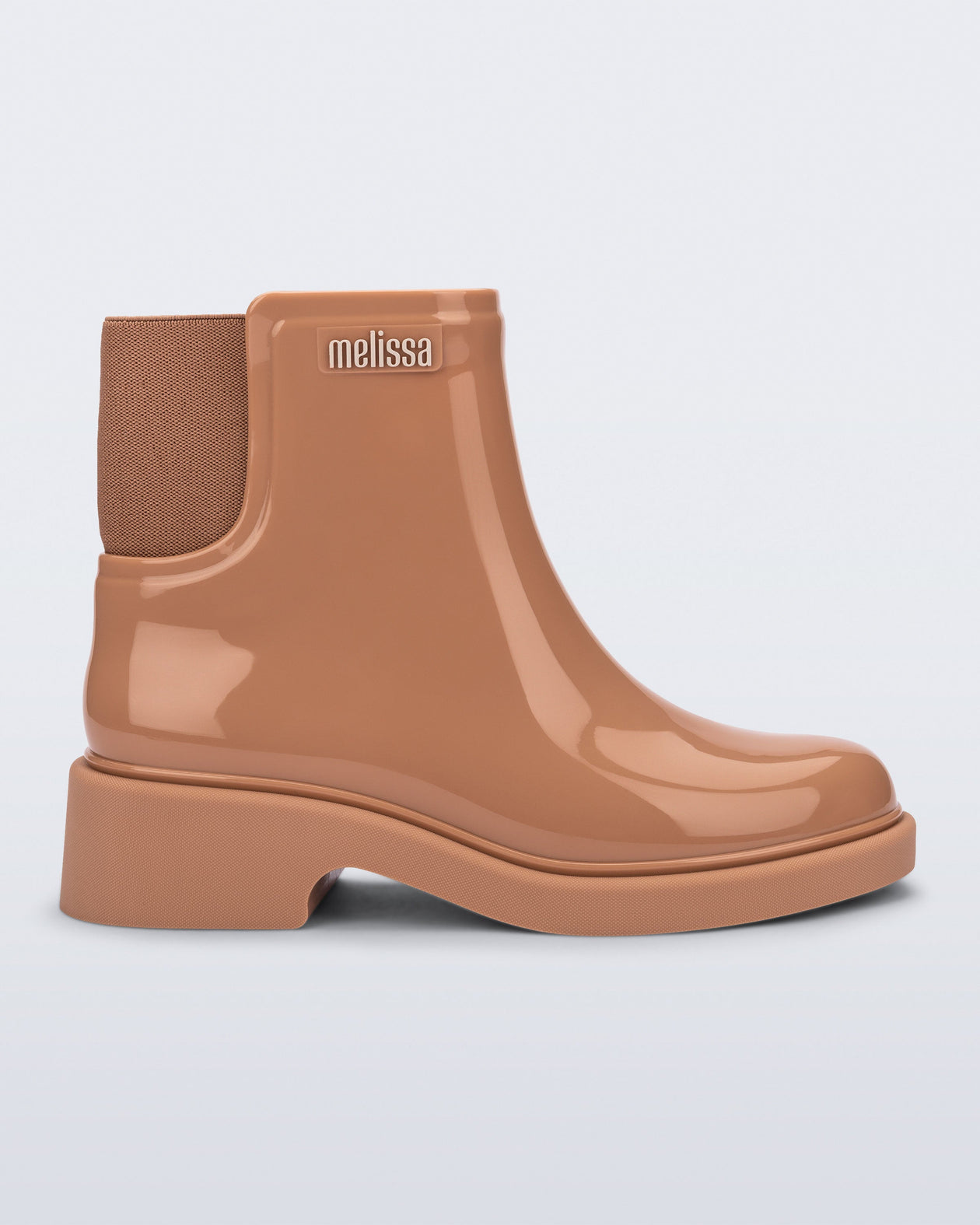 Side view of a brown Chelsea Boot