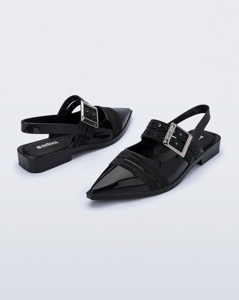 Angled view of a pair of black Ladylike flats