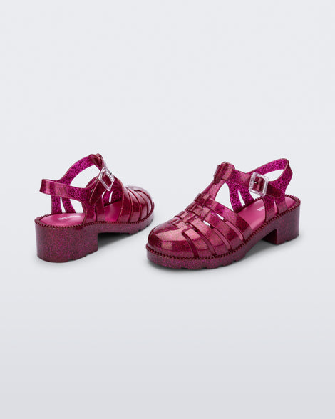 Back and side view of a pair of glitter dark pink kids Possession Heel sandals