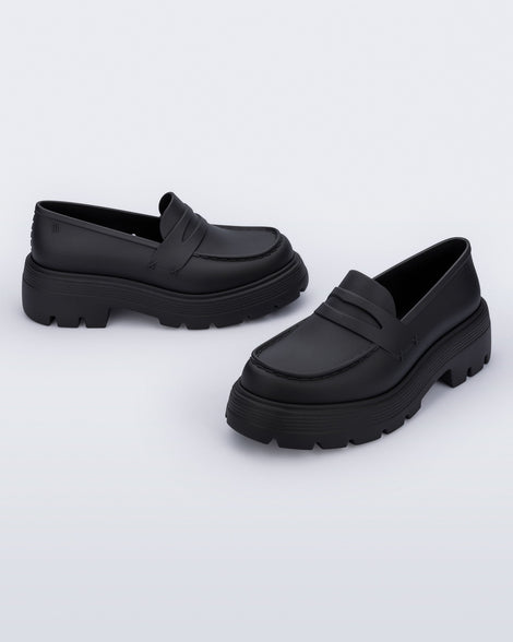 Angled view of a pair of matte black Royal adult loafers