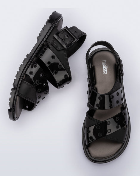 Side and top view of a pair of black Lock sandals with back strap