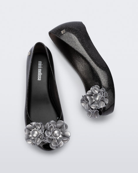 Top and side view of a pair of glitter black kids Ultragirl Springtime flats