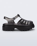 Side view of a silver Possession Platform II sandal with black sole.