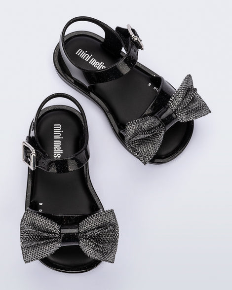 Top view of a pair of glitter black Mar Sweet baby sandals