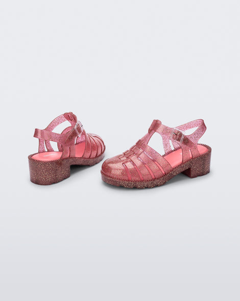 Back and side view of a pair of glitter pink kids Possession Heel sandals