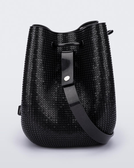 Side view of a black Lux bucket bag with drawstring and strap