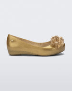 Side view of a glitter beige kids Ultragirl Springtime flats