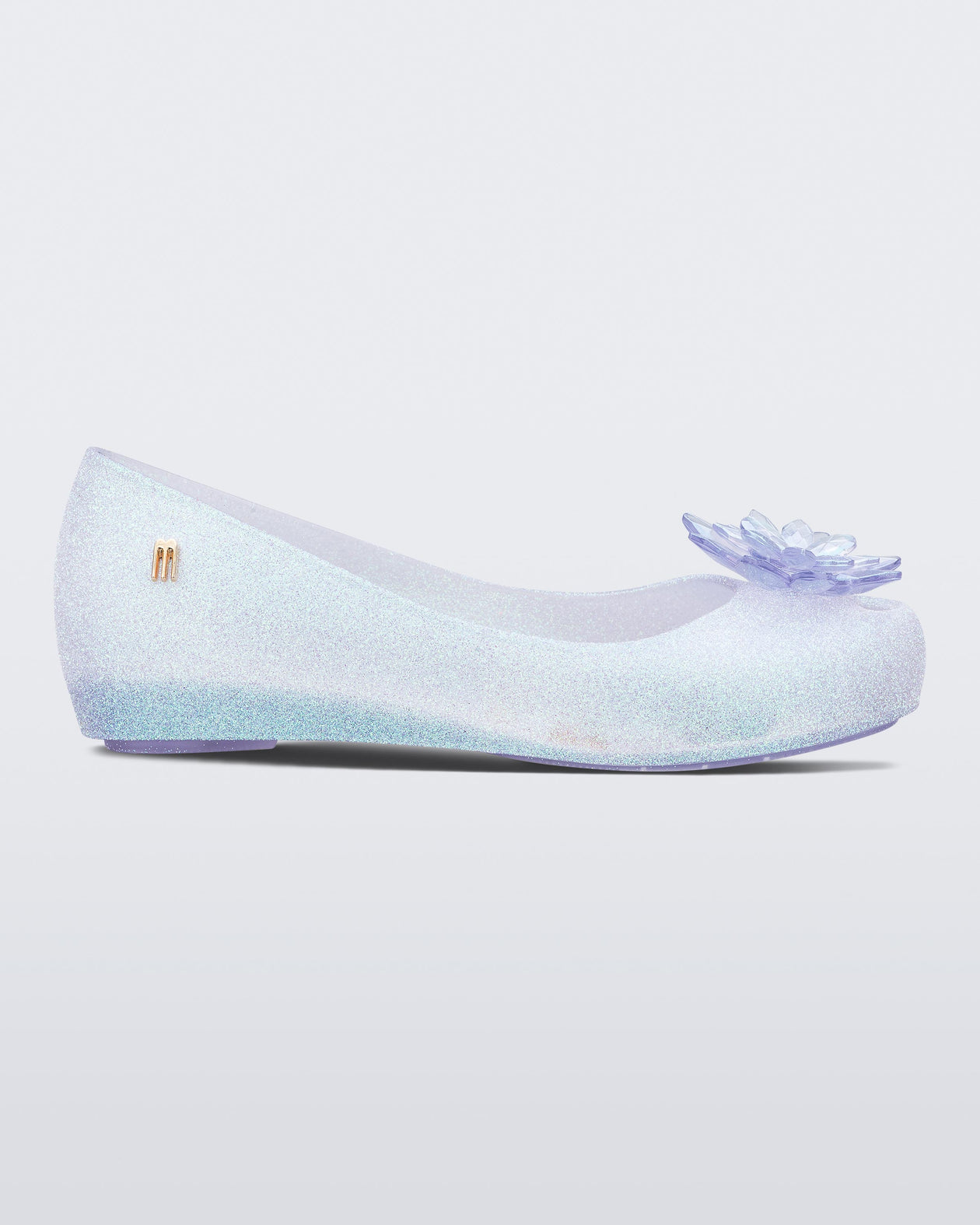 Side view of a clear/glitter kids Ultragirl Frozen flat.