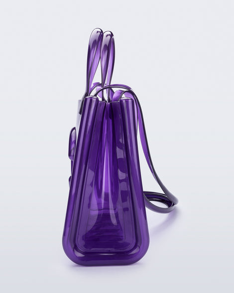 Side view of the purple Medium Jelly Shopper x Telfar bag