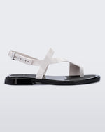 Side view of a white Cassie sandal