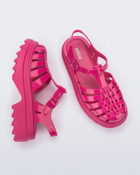 Side and top view of a pair of pink Possession Platform II sandals.