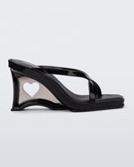 Side view of a black Glass Heel with a heart cutout in the heel.