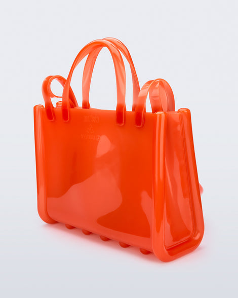 Back view of the orange Medium Jelly Shopper x Telfar bag