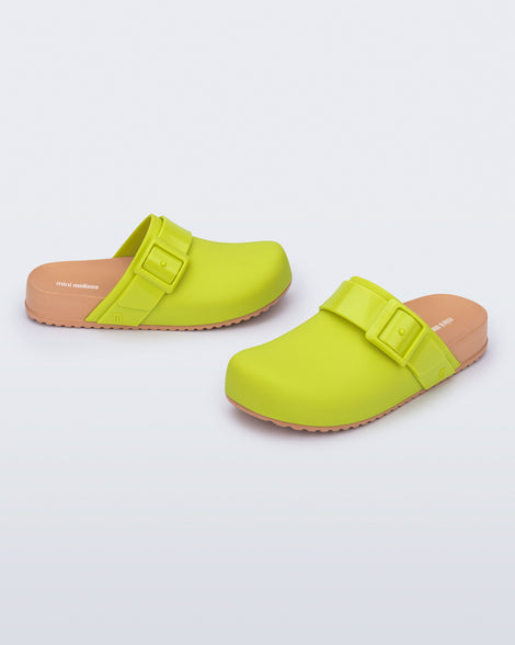 Angled view of a pair of green kids Cozy Clogs