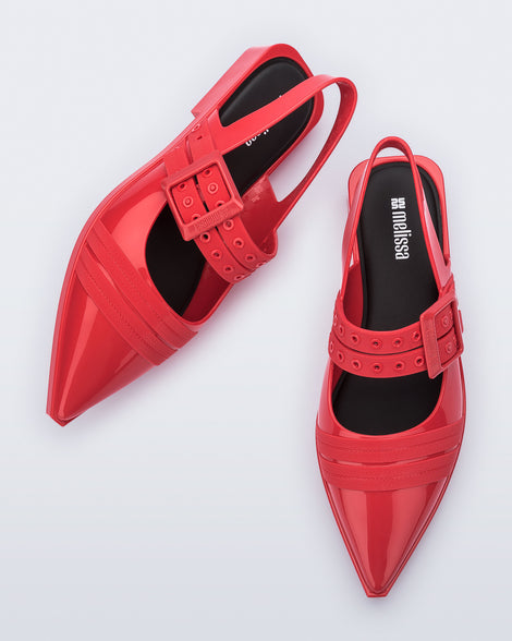 Angled and top view of a pair of red Ladylike flats