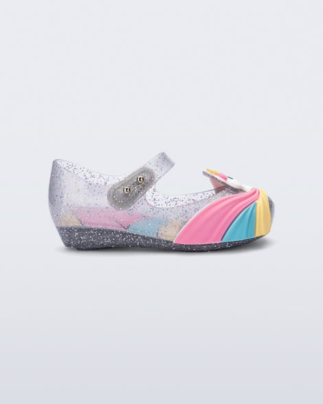 Side view of a glitter clear/pink  baby Ultragirl Unicorn flat