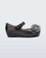 Side view of a glitter black baby Ultragirl Springtime flats