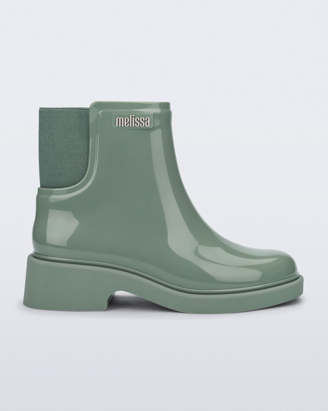 Side view of a sage green Chelsea Boot