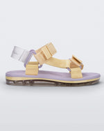 Side view of a purple soled Melissa Papete sandal with yellow and purple straps.