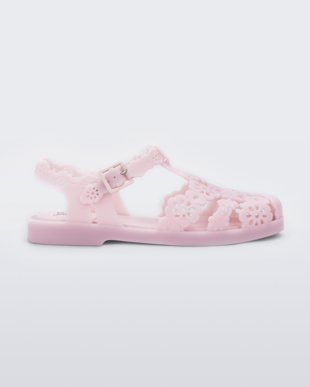 Side view of a Melissa Possession fisherman sandal in pink with cut out lace detail on the straps.