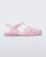 Side view of a Melissa Possession fisherman sandal in pink with cut out lace detail on the straps.