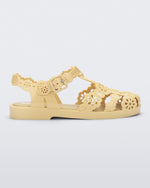 Side view of a Melissa Possession fisherman sandal in yellow with cut out lace detail on the straps.