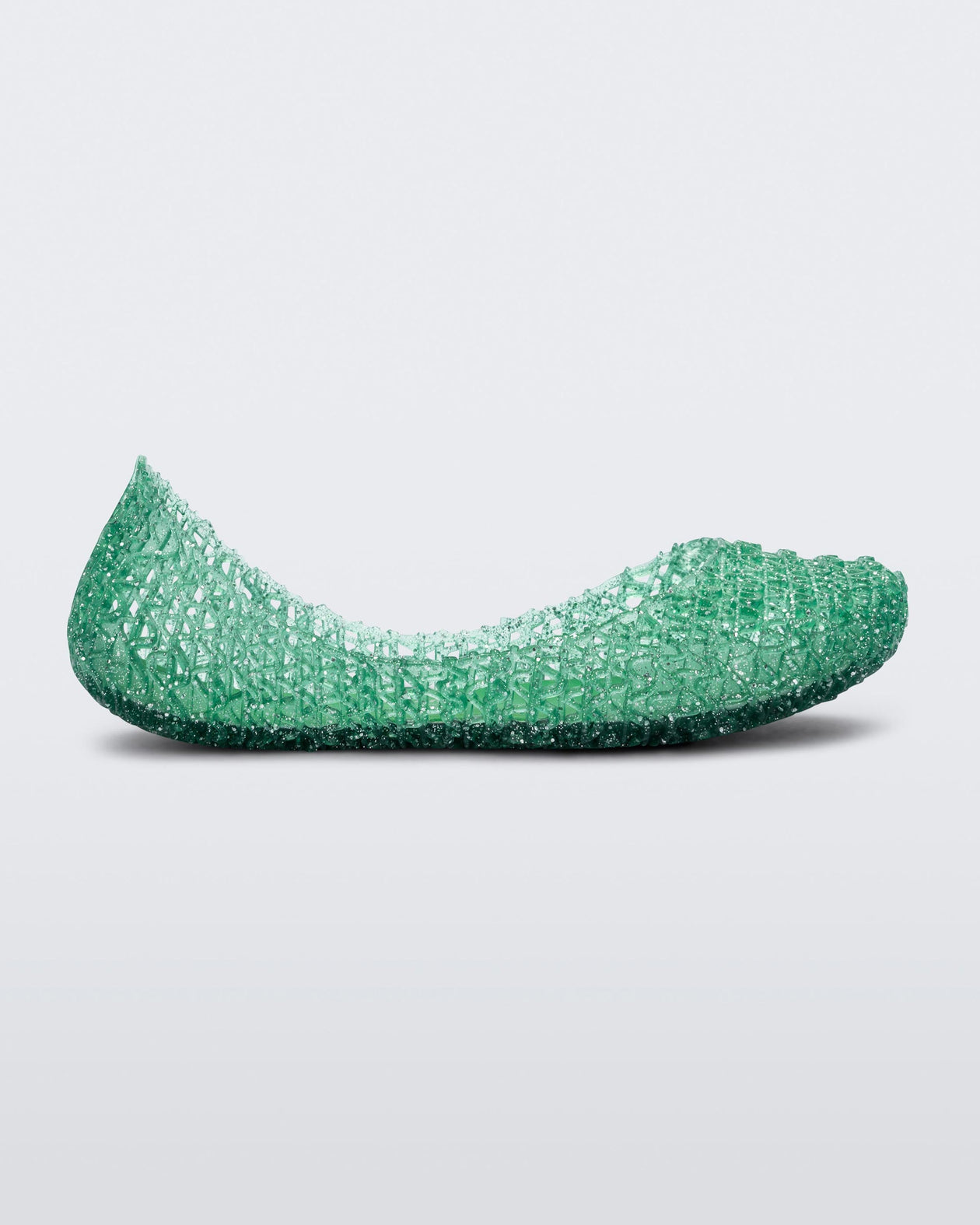 Side view of a green Mini Melissa Campana flat with an open woven texture.