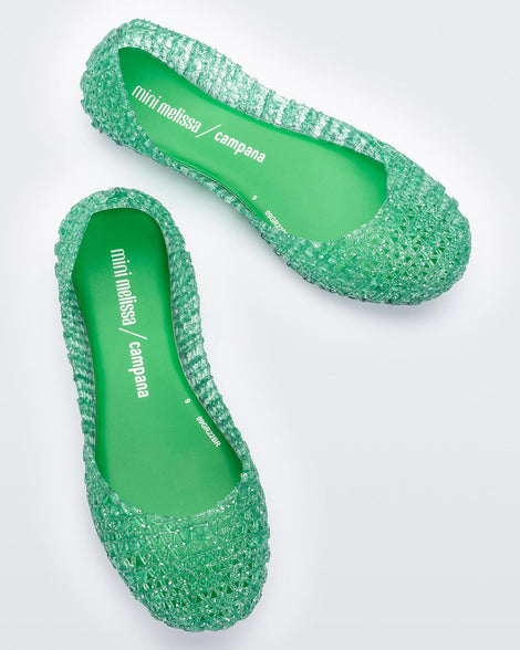 Top view of a pair of green Mini Melissa Campana flats with an open woven texture.