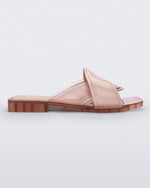 Side view of a pink Melissa Brigitte slide with a solid and transparent weft designed upper strap.