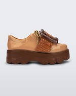 Side view of brown/beige Melissa Buckle Up Kick Off platform sneakers.