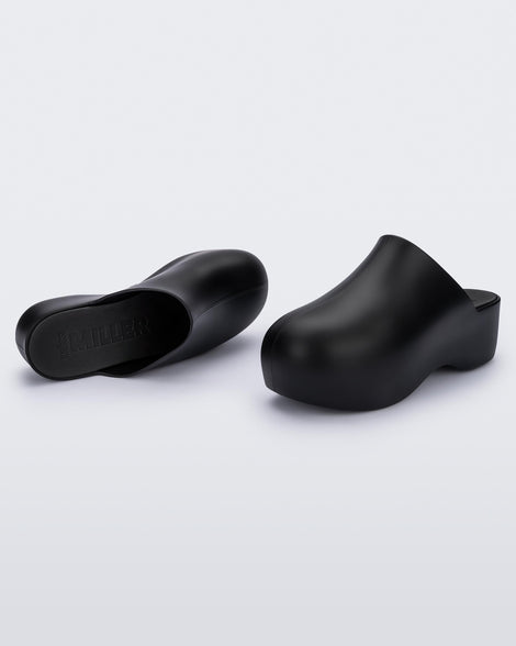 Angled view of a pair of black Melissa Bubble clog from the Simon Miller collaboration.