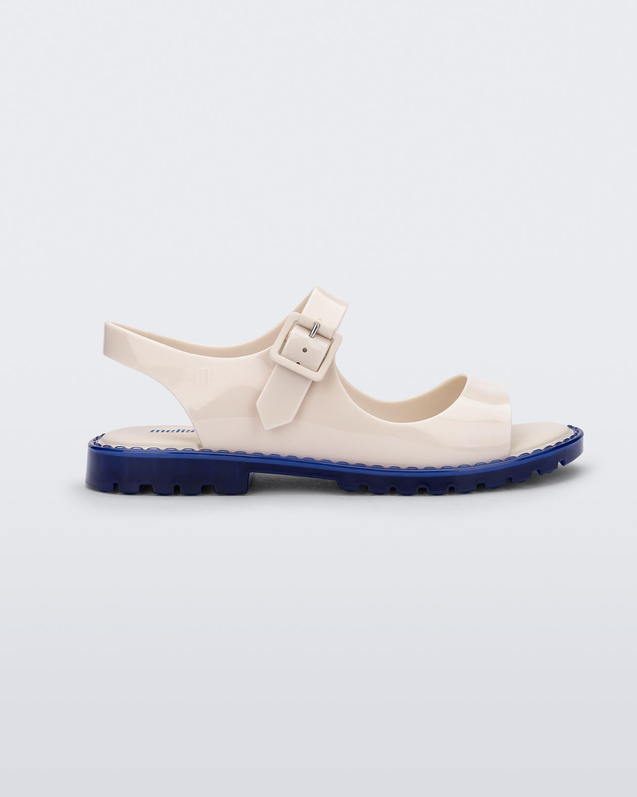 Side view of white Melissa Bae white sandal with a blue sole.