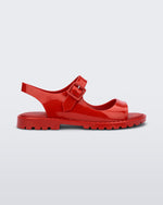 Side view of red Melissa Bae sandals.