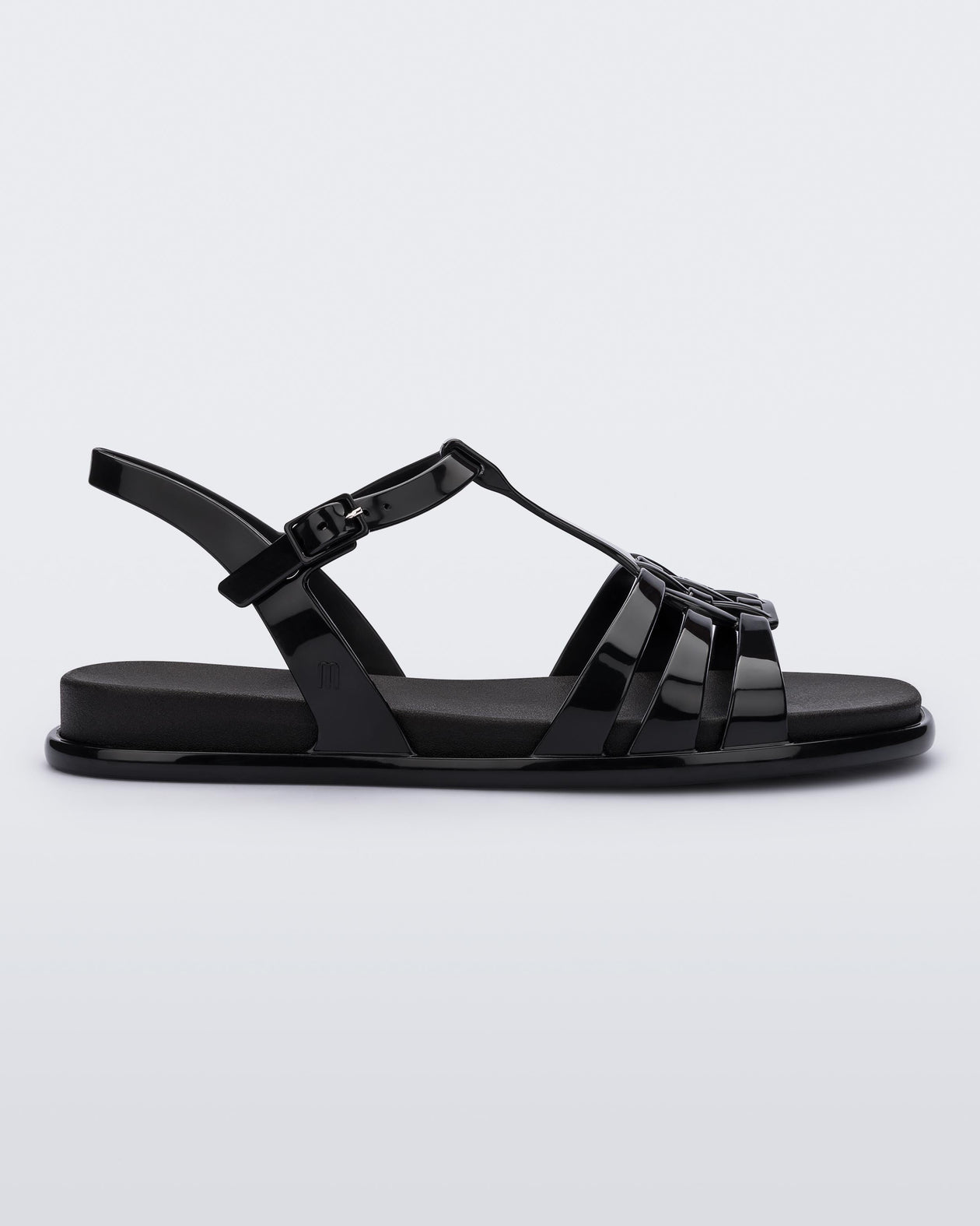 Side view of a Melissa Party sandal in black with back ankle strap and buckle closure 