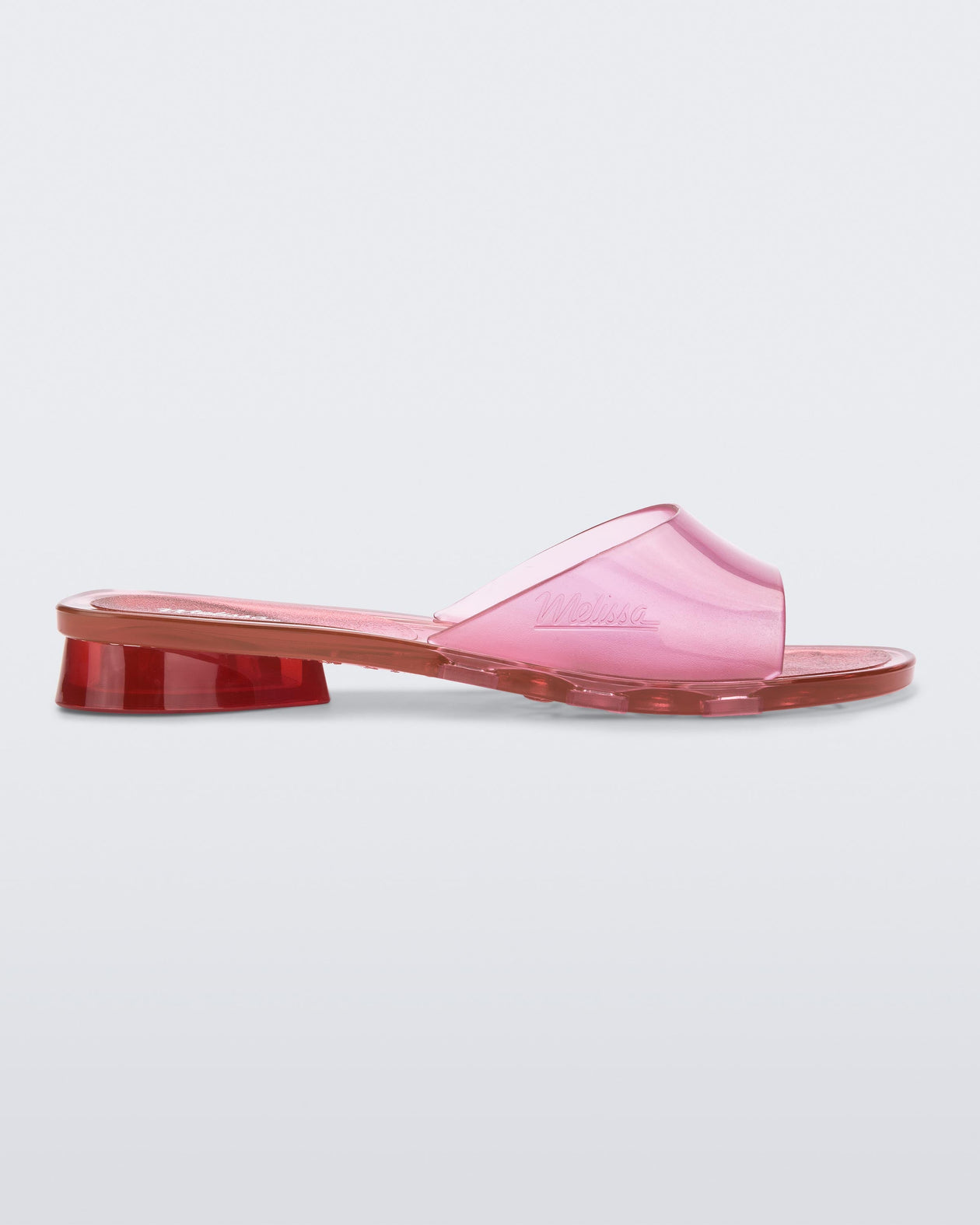 Side view of a pink transparent Melissa Kim slide.