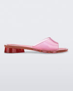 Side view of a pink transparent Melissa Kim slide.