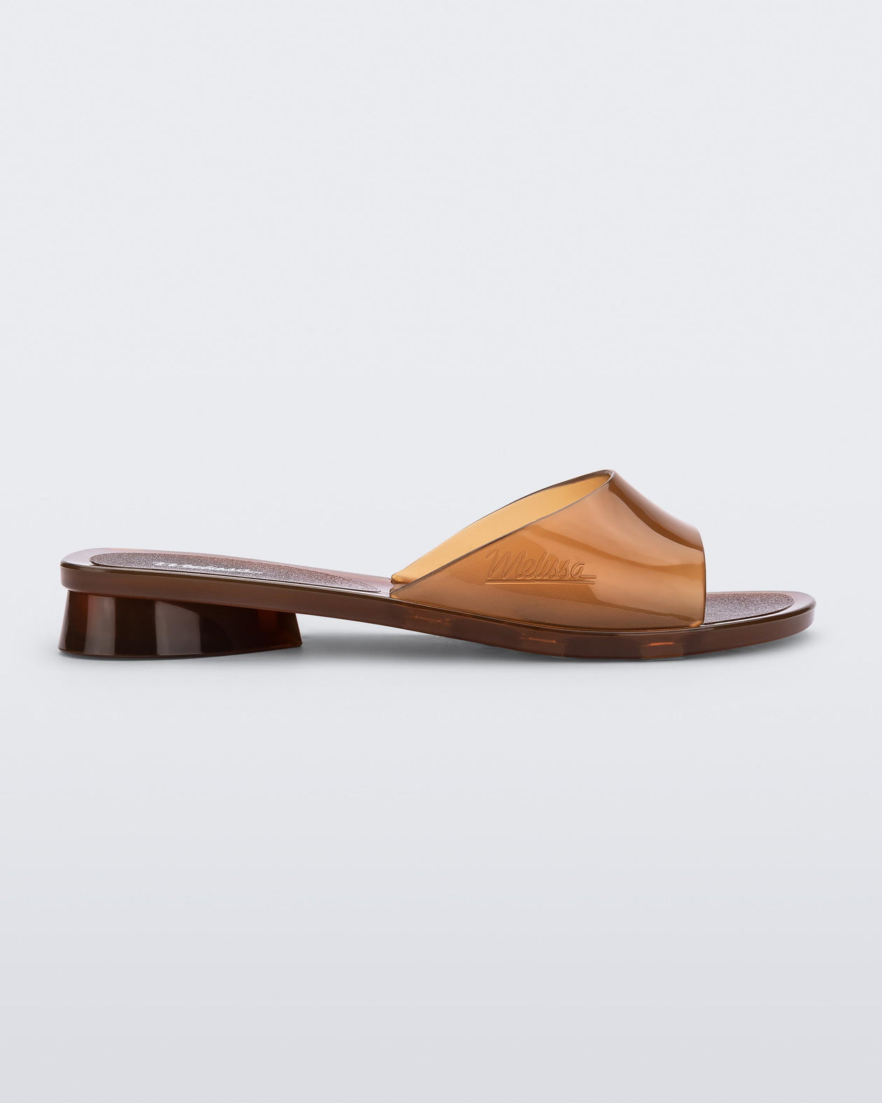 Side view of a transparent brown Melissa Kim slide.