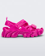 Side view of a Melissa Puff chunky sandal in pink with velcro straps