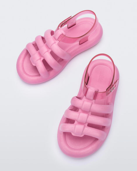 Top view of a pair of pink Melissa Freesherman sandals with pink and clear straps.