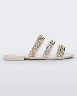 Side view of a white Melissa Feel slides with three gold and silver chain detail straps.